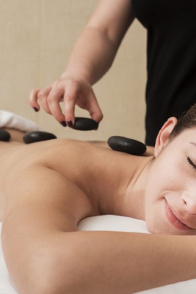 woman-enjoying-hot-rocks-therapy-spa